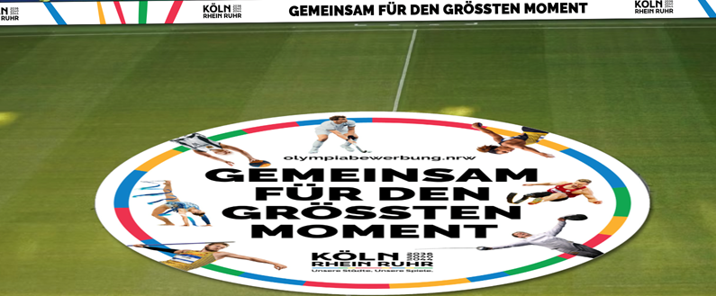 Mittelkreis-Werbung in einem Fußballstadion für die Bewerbung KölnRheinRuhr